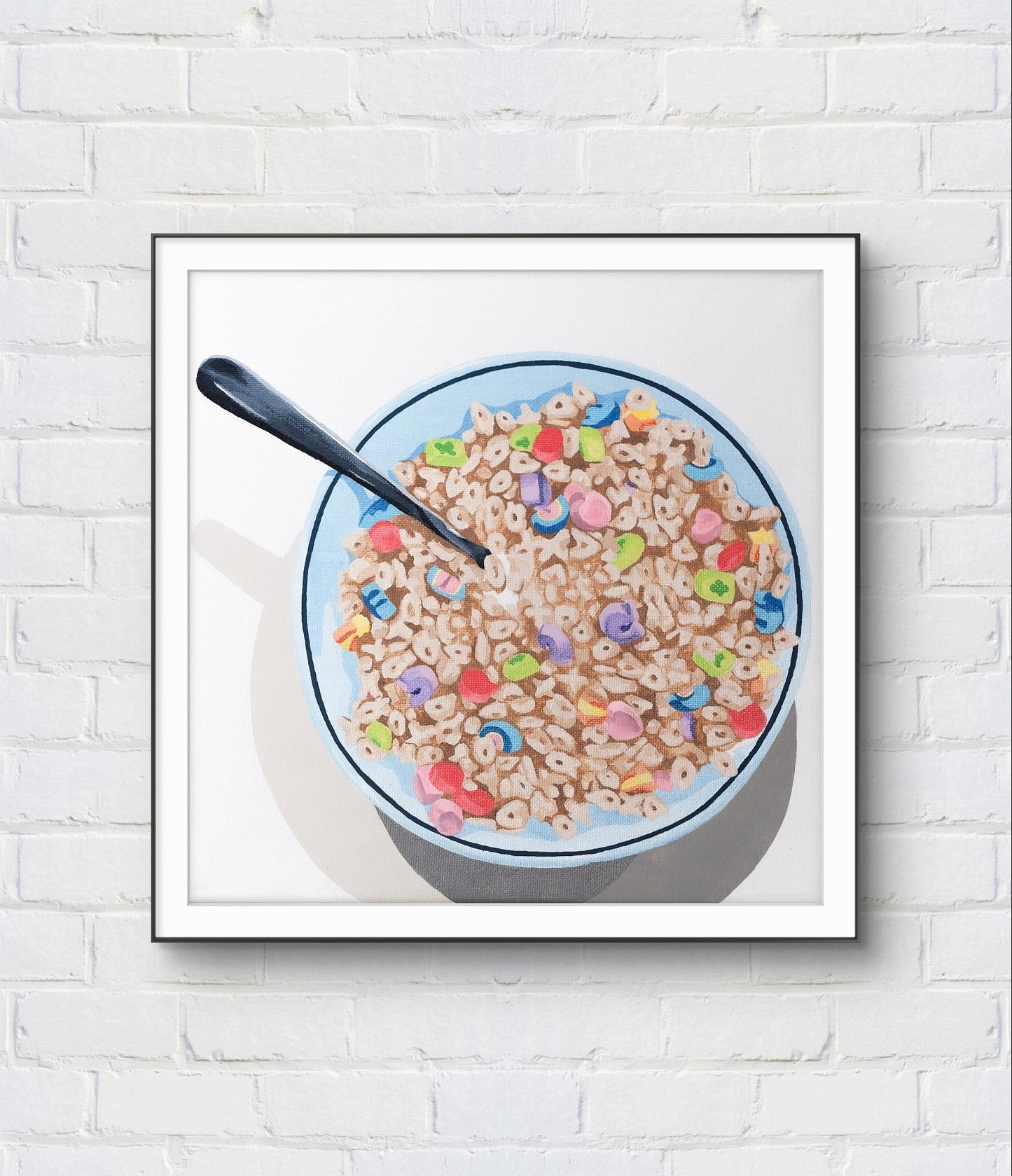 Framed picture of a bowl of cereal with milk on a white brick wall