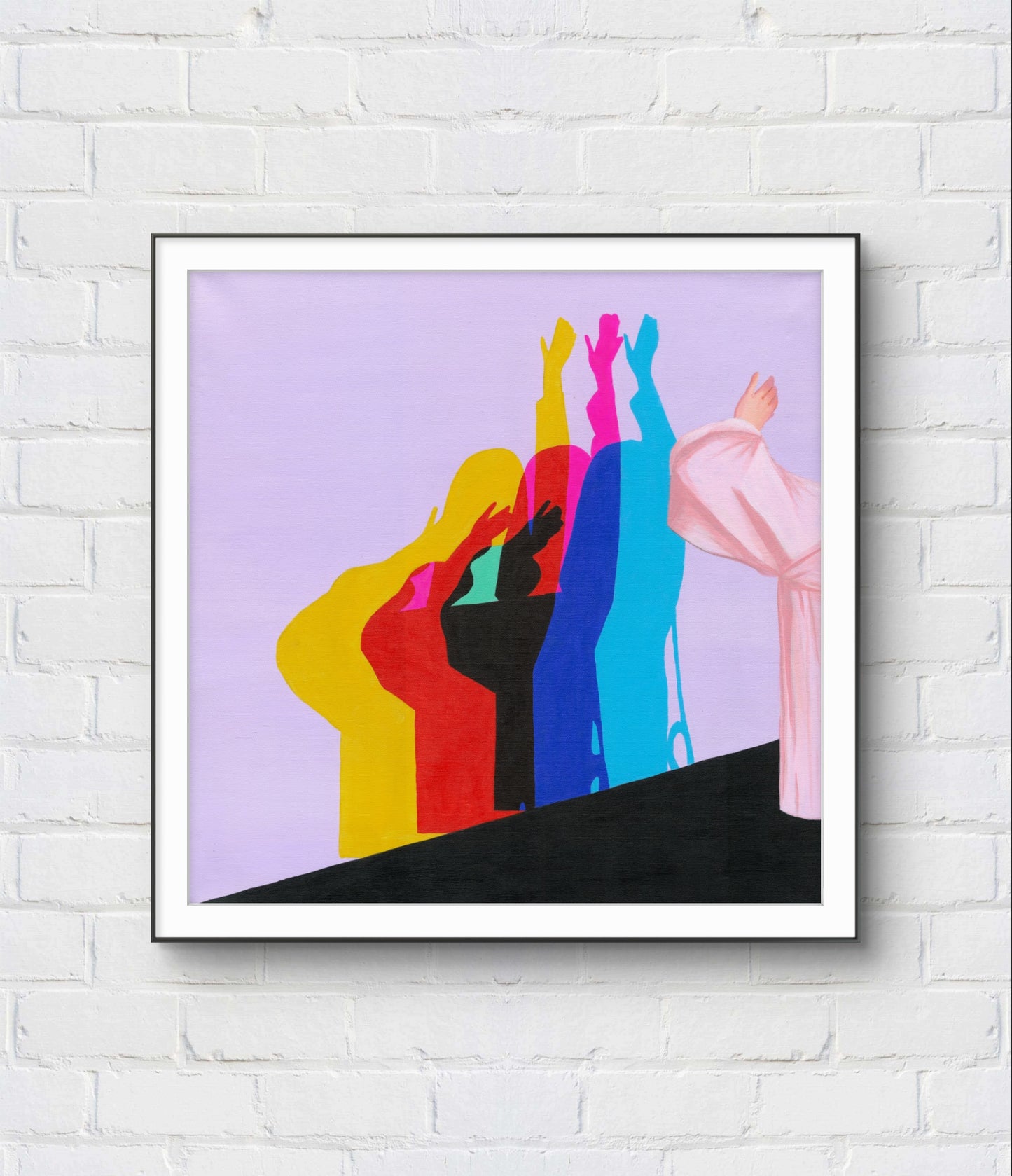 Framed abstract art with colorful figures on a white brick wall