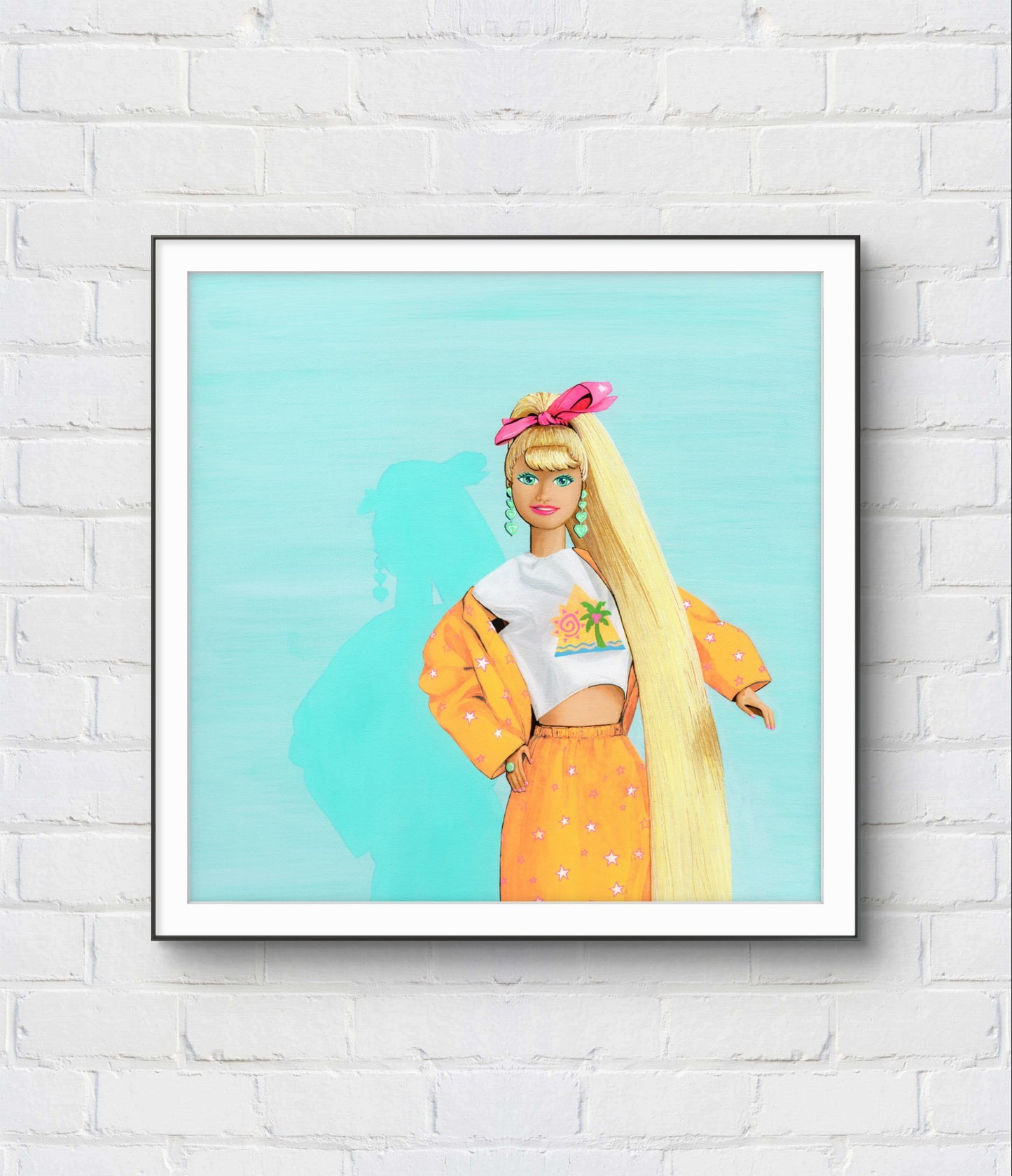 Framed artwork of a stylized character with long blonde hair and a yellow outfit on a light blue background, displayed on a white brick wall.