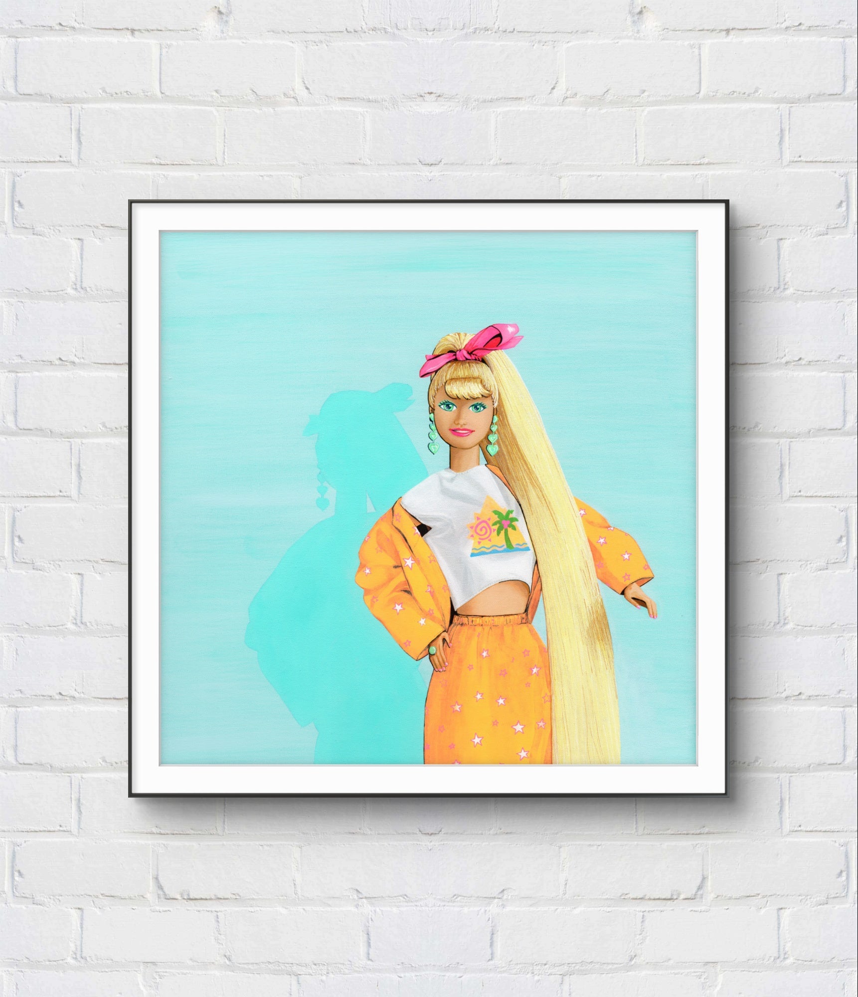 Framed artwork of a stylized character with long blonde hair and a yellow outfit on a light blue background, displayed on a white brick wall.