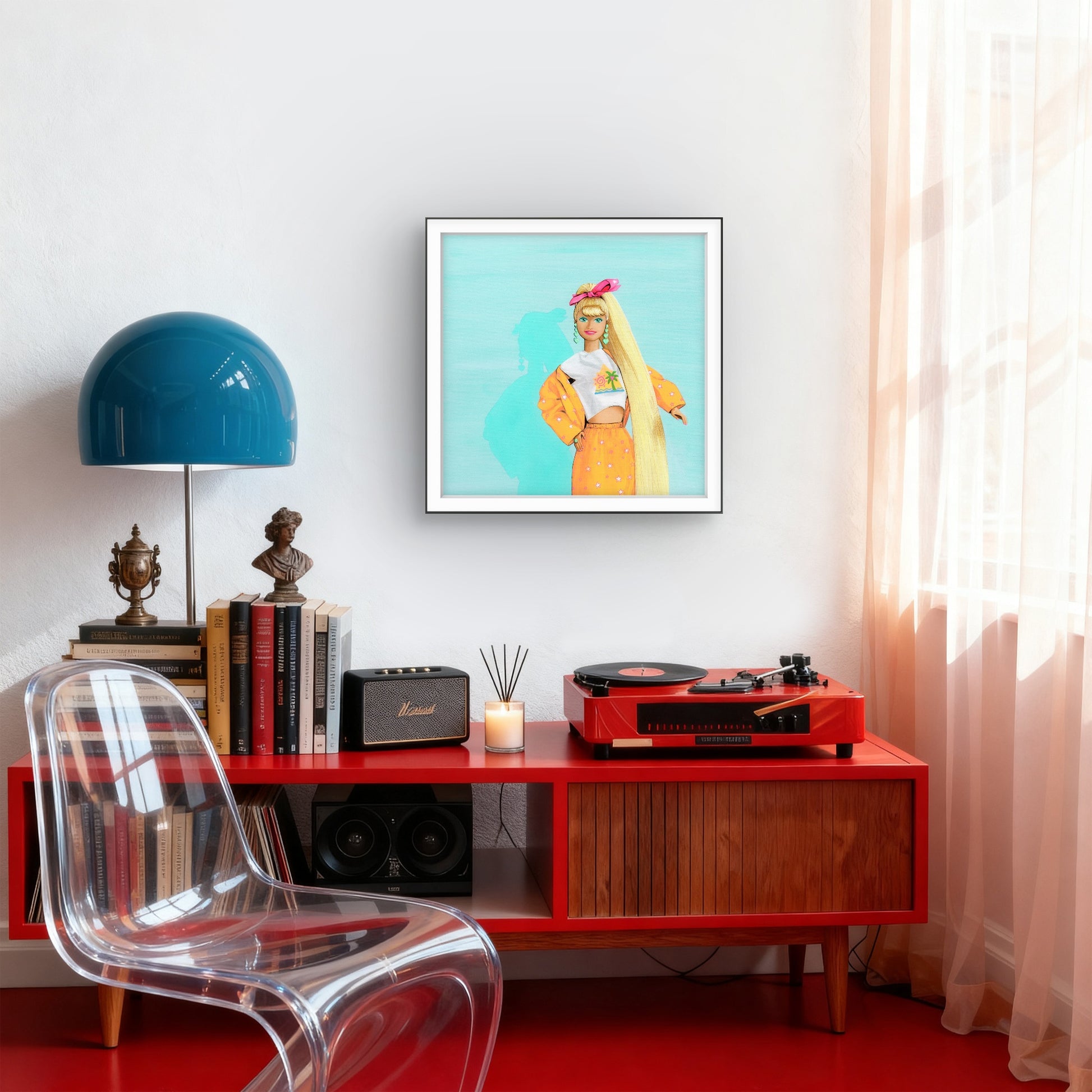 Modern interior with a red console table, clear chair, blue lamp, and framed artwork.