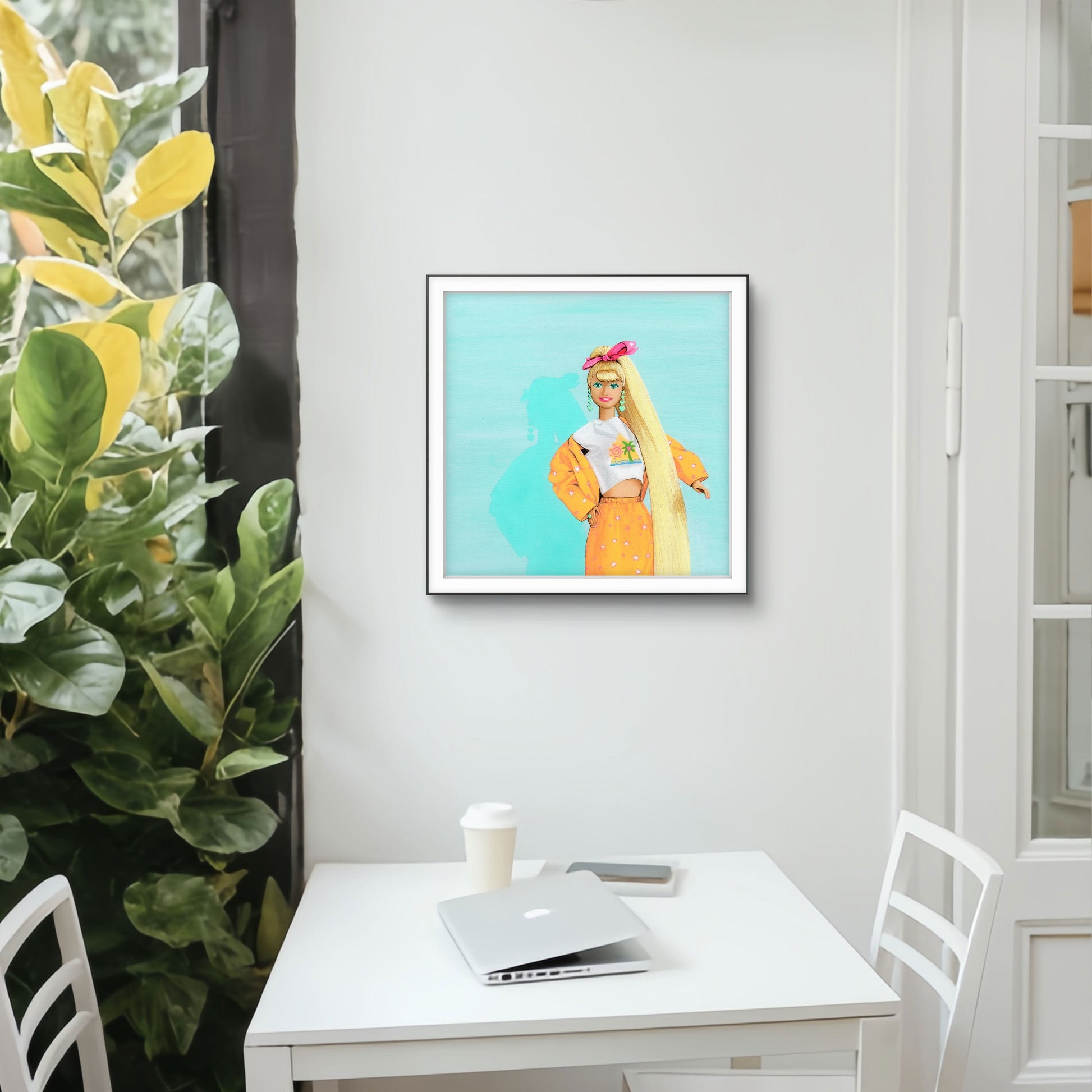 Framed artwork of a person with long blonde hair on a wall above a desk.