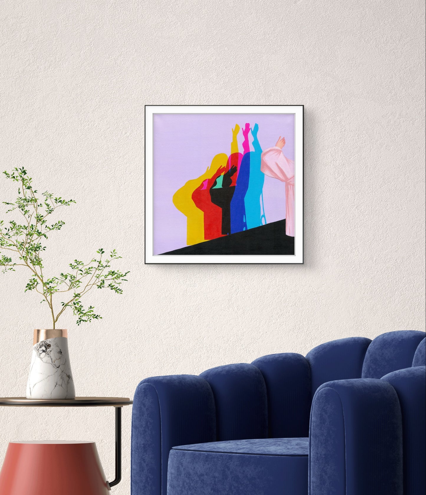 Framed abstract artwork with colorful figures on a wall above a blue armchair.